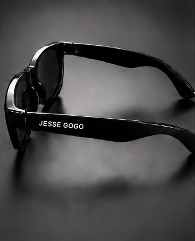 Black sunglasses side view with JESSE GOGO printed on the arm.