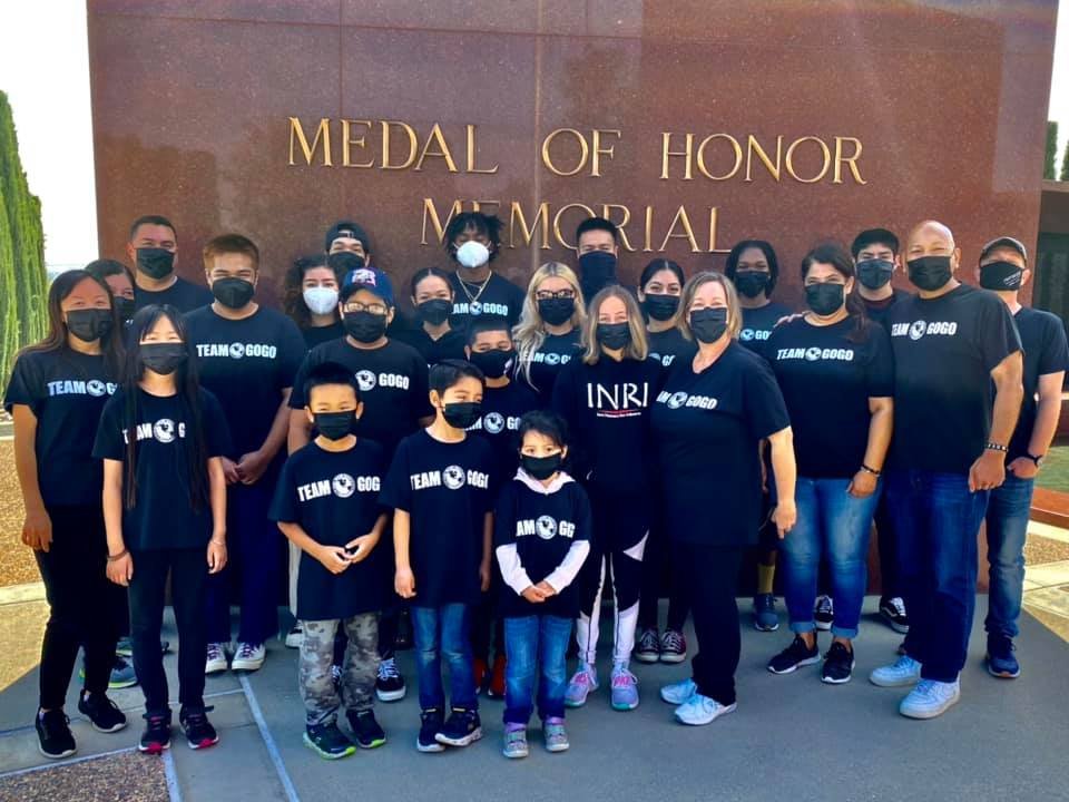 TEAM GOGO group gathered in front of the Medal of Honor Memorial.